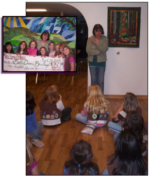 Betty receives a check for $250 from a local Brownie troop, March 26, 2009